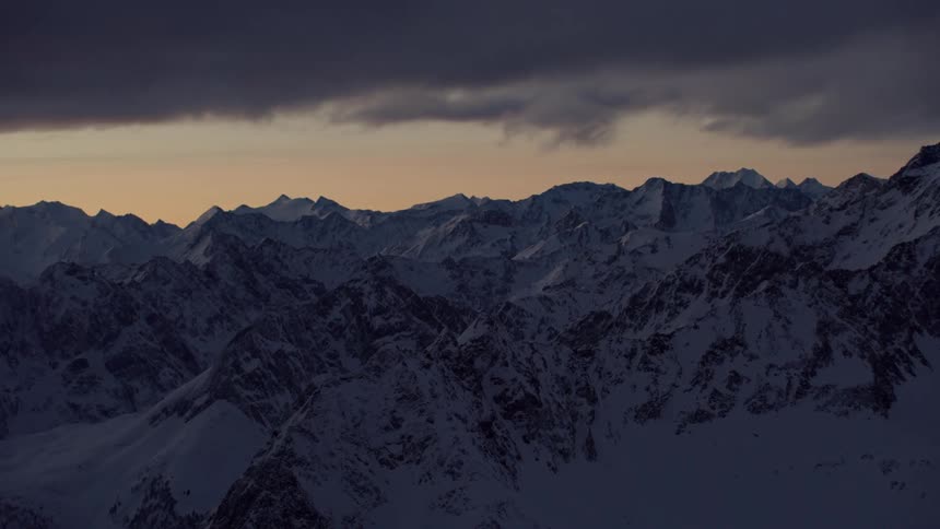 View of snowy mountains at sunset