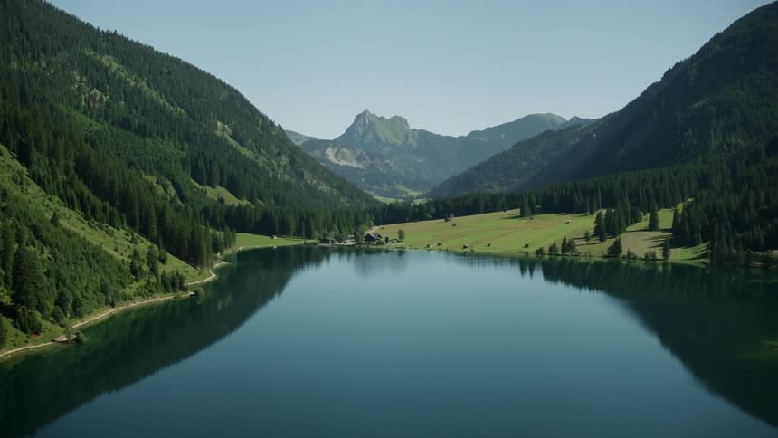 A placid lake at the base of a mountain