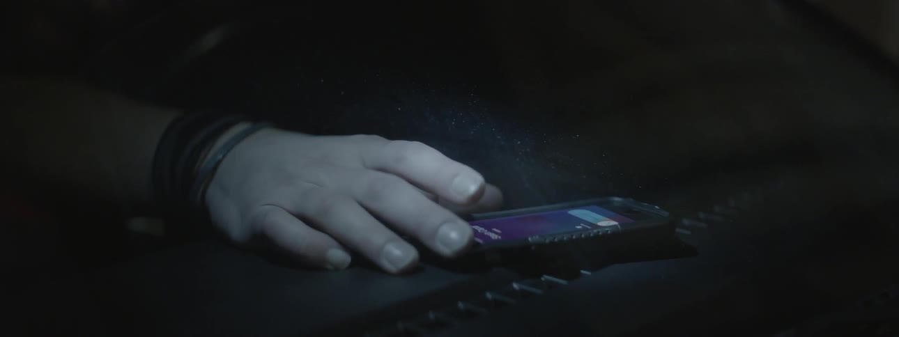 A person picks up their phone