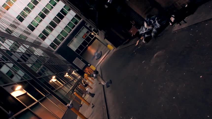 Pigeons fly in the air as the street is passed