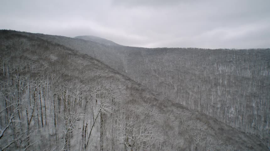 The hills are covered with frost and snow as far as can be seen