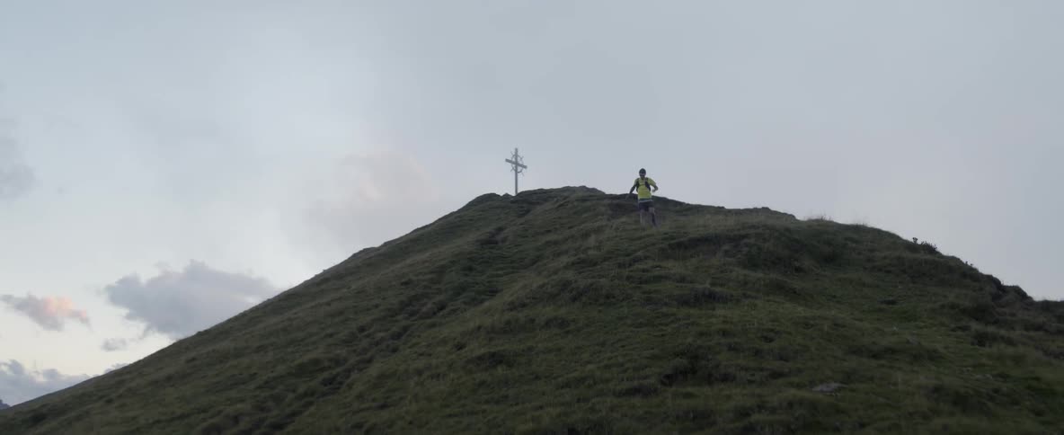 A man runs down the mountain fast