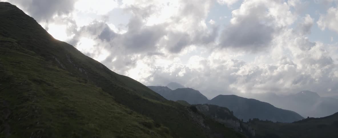 A man jogging up a large mountain side