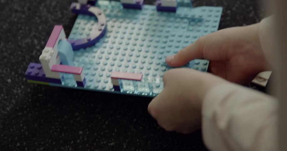 A child plays with lego blocks