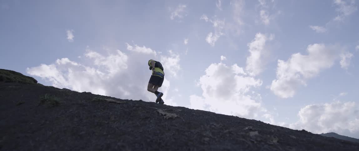 Man jogs up a steep hill