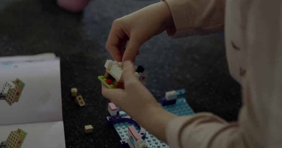 Child puts legos together