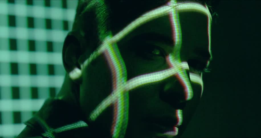 Grid lights flash on a man's face
