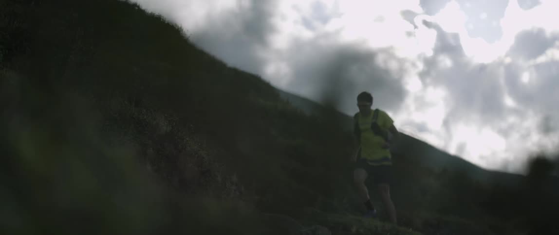 A man runs up a mountainside