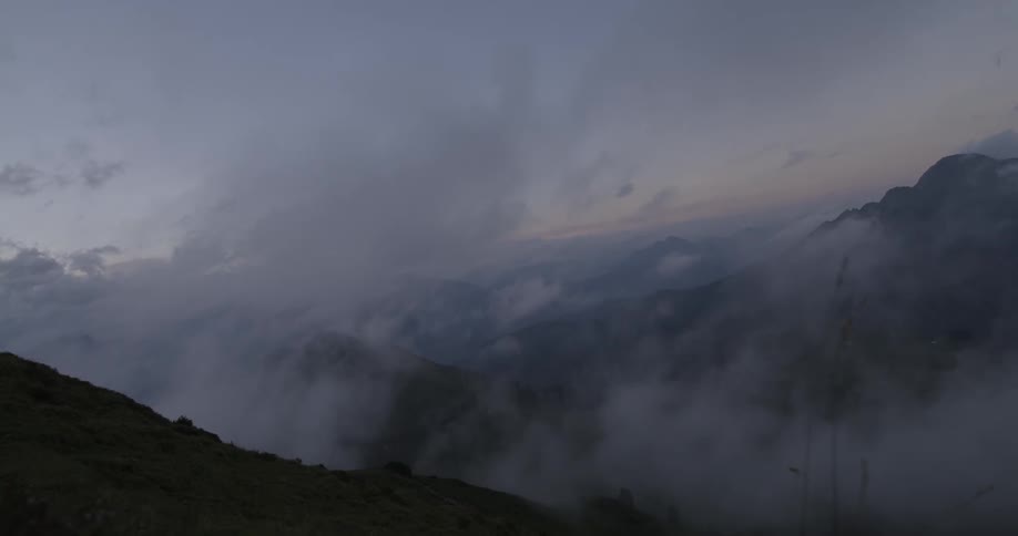 Clouds and fog pass through mountains