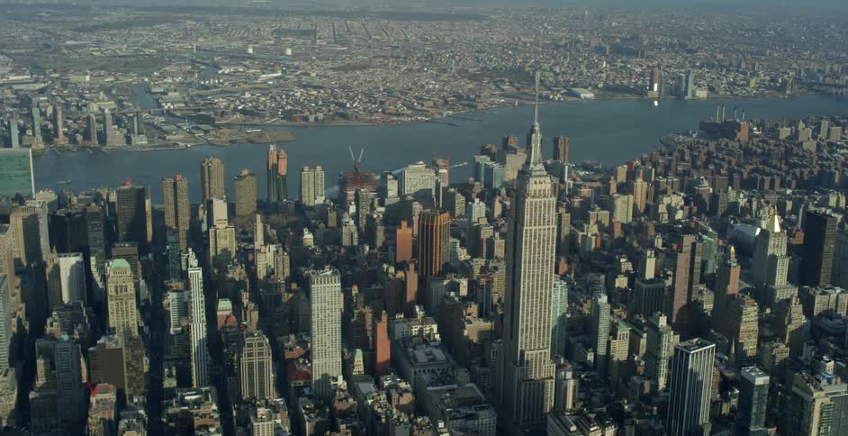 Wide aerial view of manhattan with the empire state building center frame