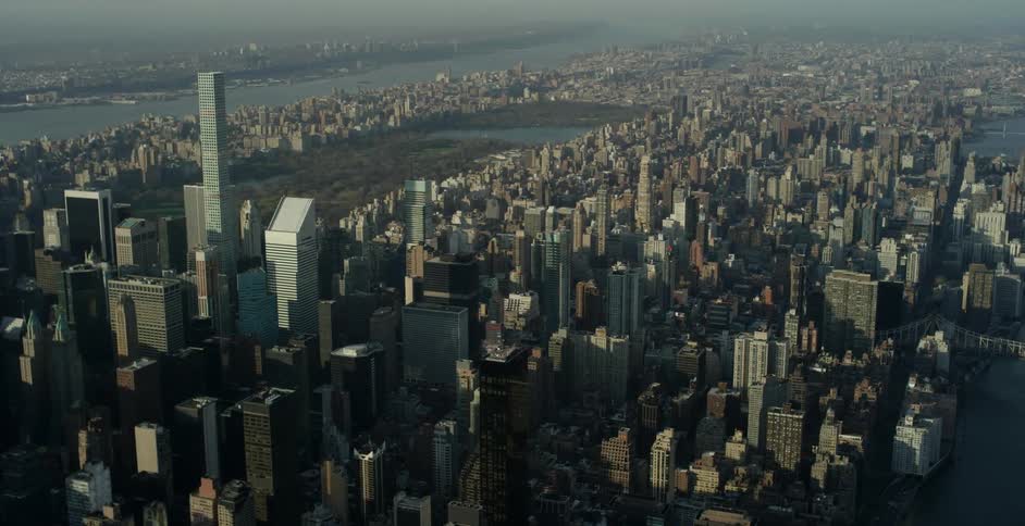 Aerial view of a city during the day with some fog