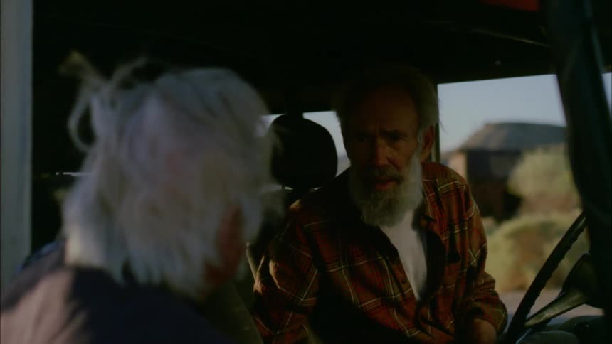 People argue briefly before one gets into the truck