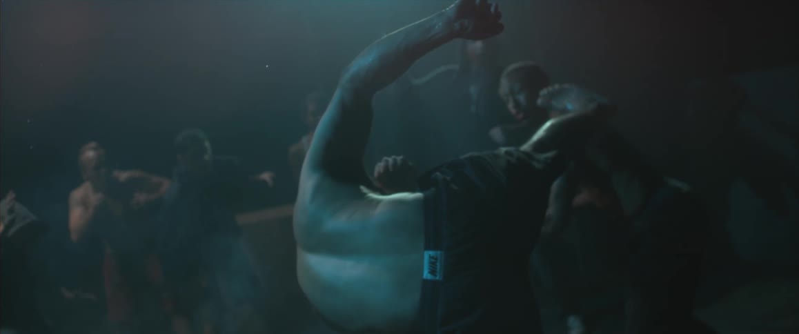 Man performs roundhouse kick on another fighter