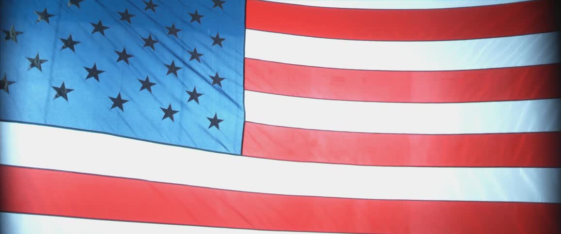 Close up of an american flag blowing in the wind