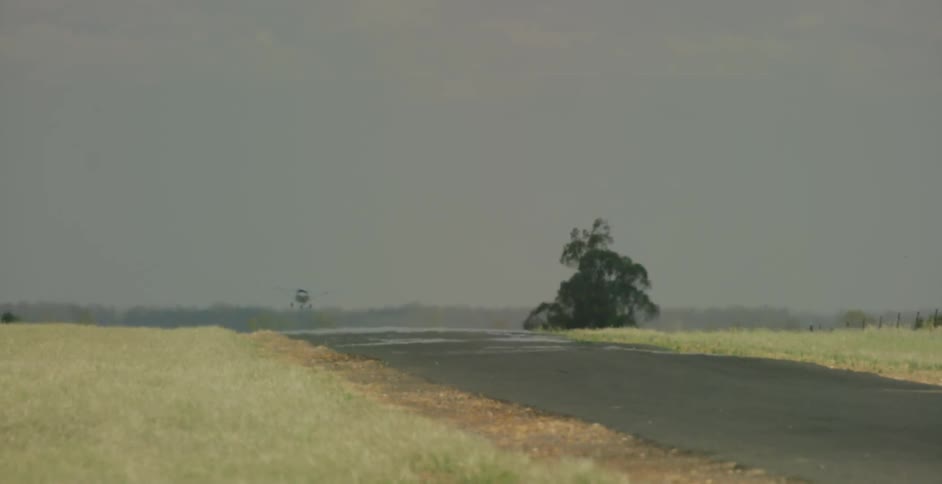 A drone is flying through the cloudy sky