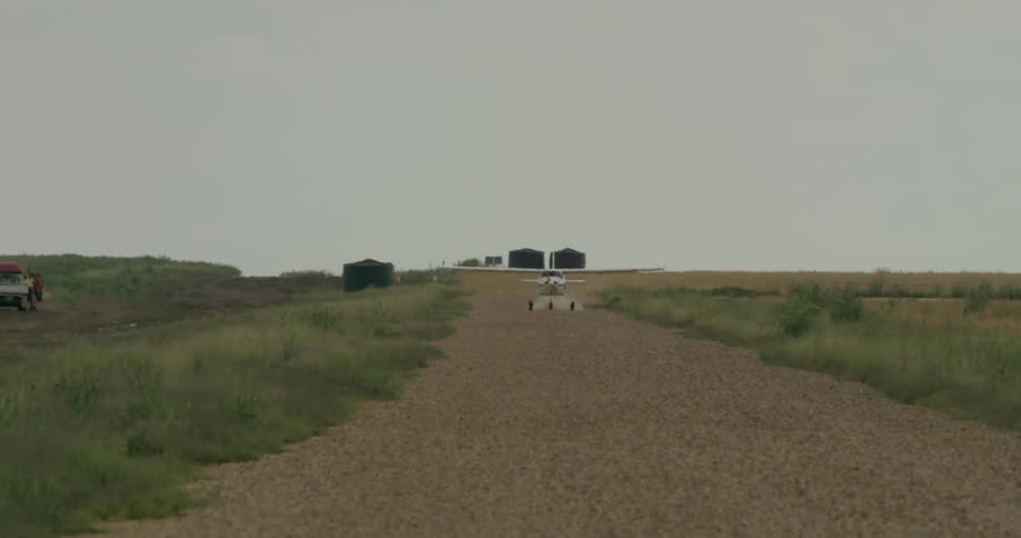Airplane landing on a dirt path