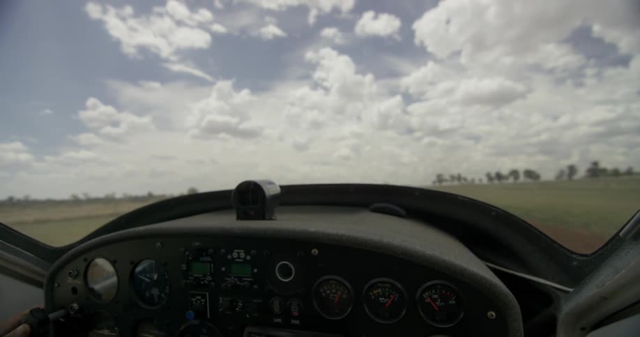 View looking out of an airplane and it's twirling propeller