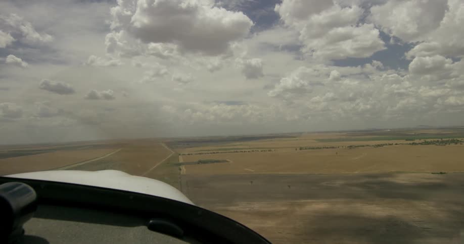 A rotor airplane flies low in the sky