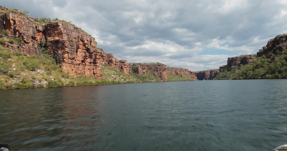 Rocky cliffs surround a lake