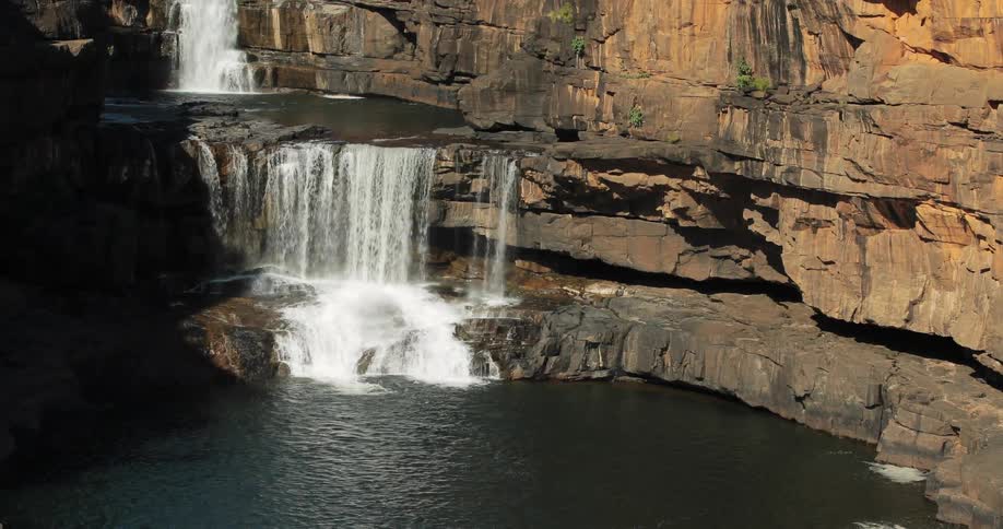 Waterfall splashing down into a pool