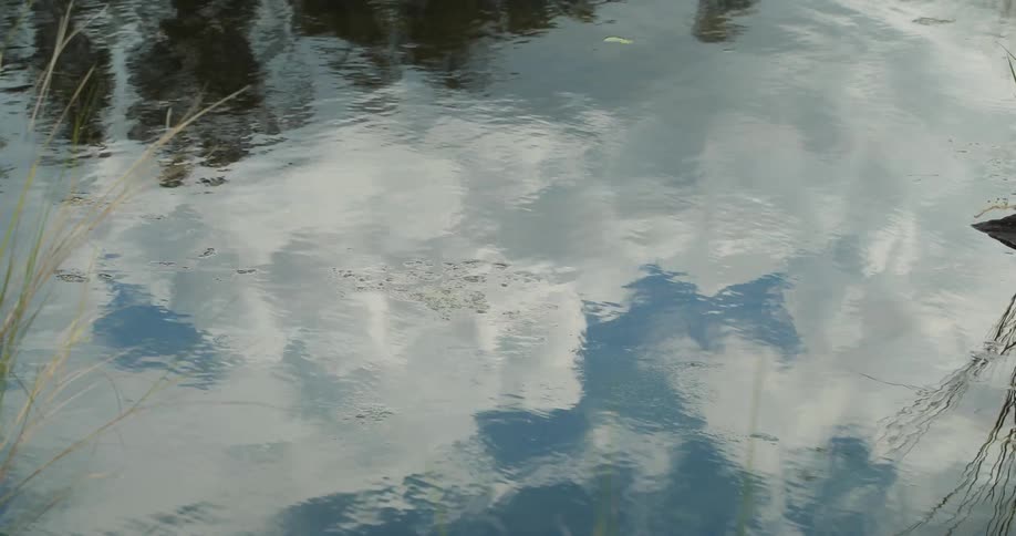 The sky is reflected on rippling water