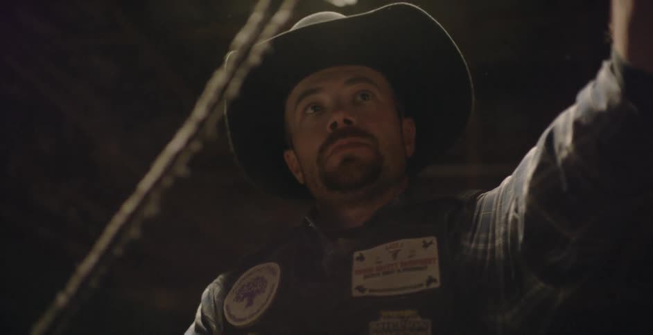 A cowboy is preparing a rope