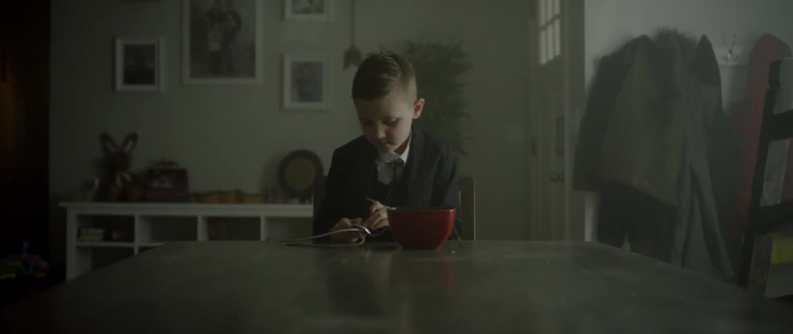 Child weaves a piece of rope