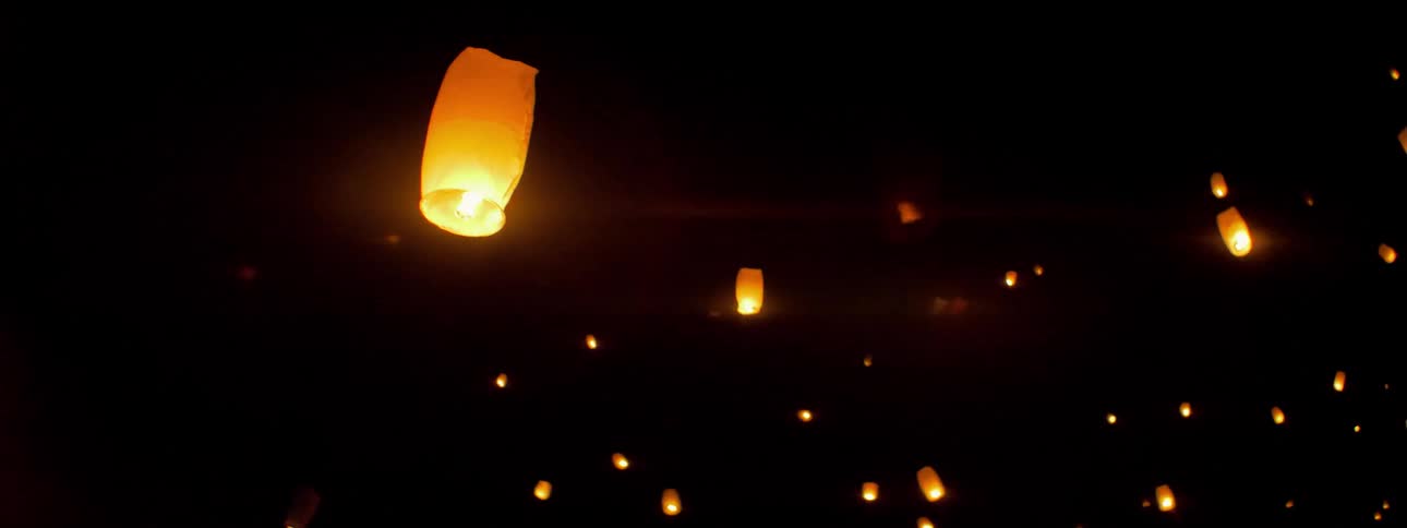 Lanterns are released and float into the sky