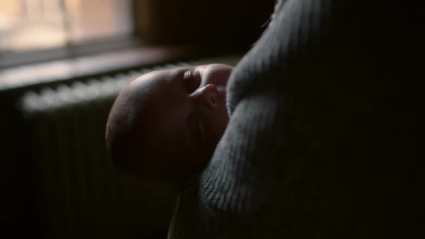Baby is being gently rocked while sleeping