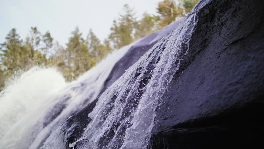 Water streams down a rock cliff