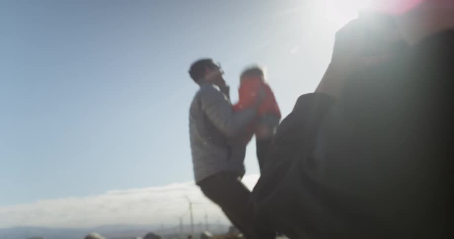 A boy photographs two people playing