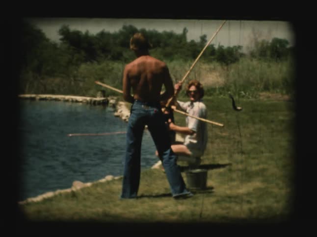 Man and child fishing in a lake