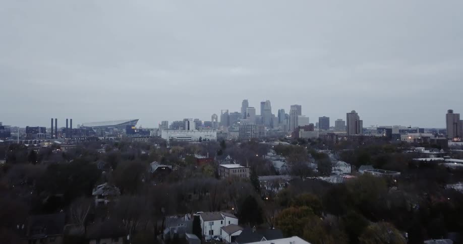 City buildings are shown on an overcast day