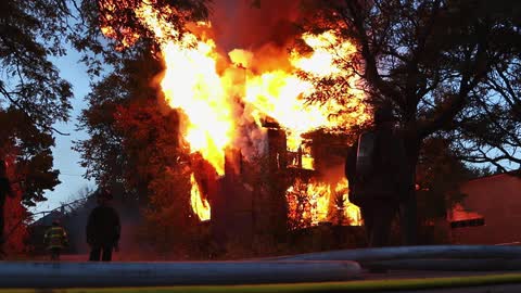 Firefighters attempt to extinguish a fire