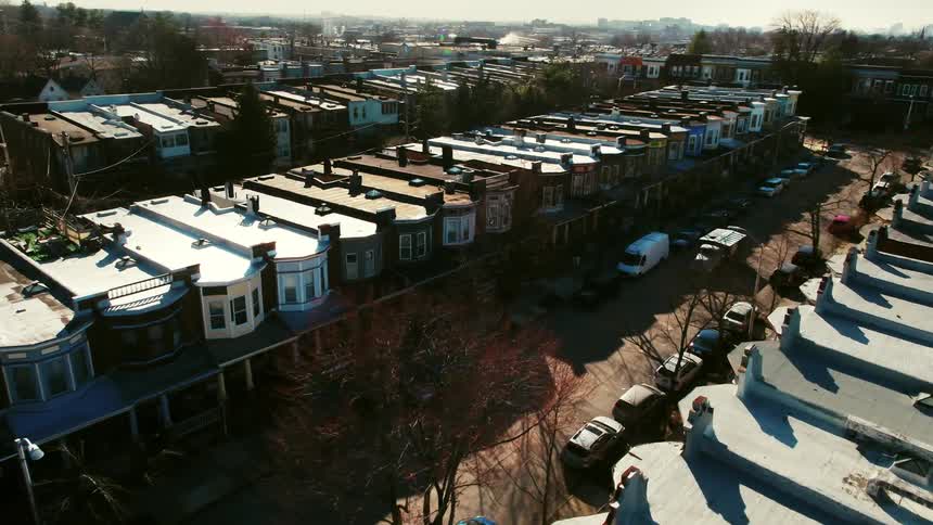 Townhouses line each side of the city road