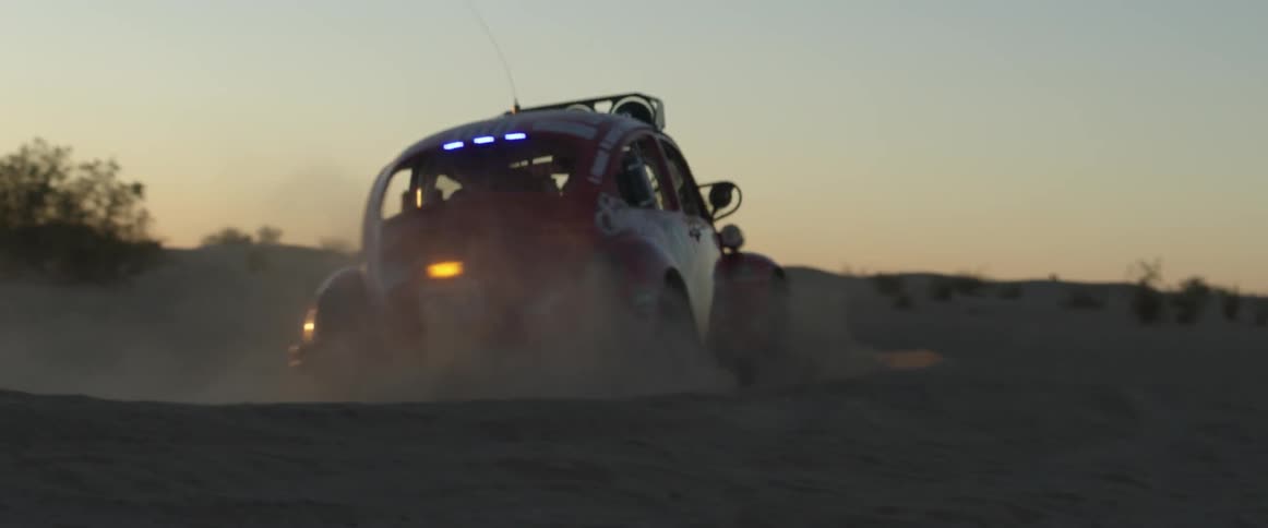 A vw bug races during an off-road desert race