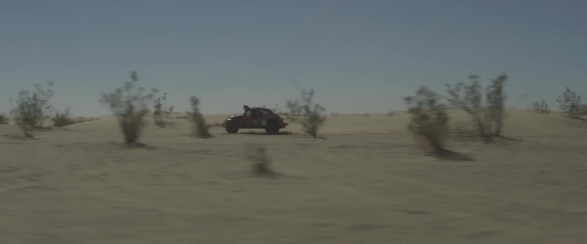 A vw bug races during an off-road desert race
