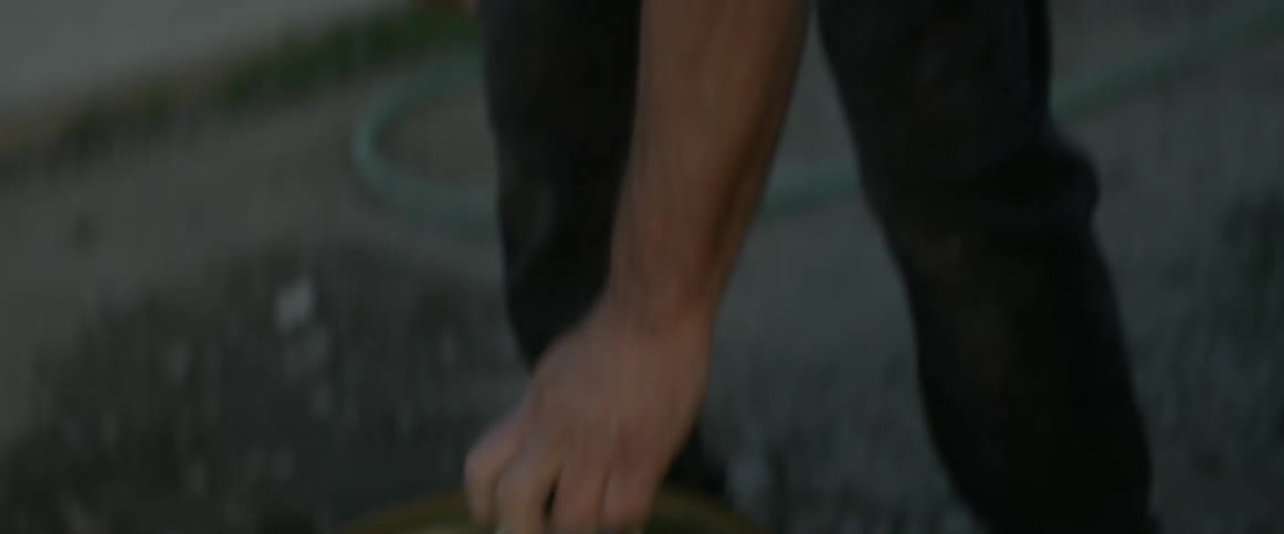 A man is opening a large container