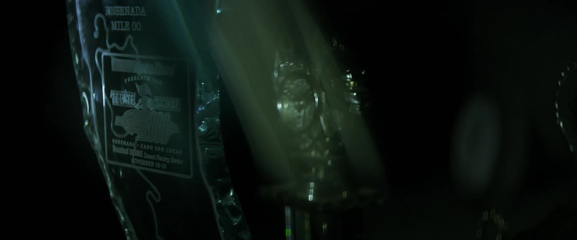 A fleeting light illuminates a trophy