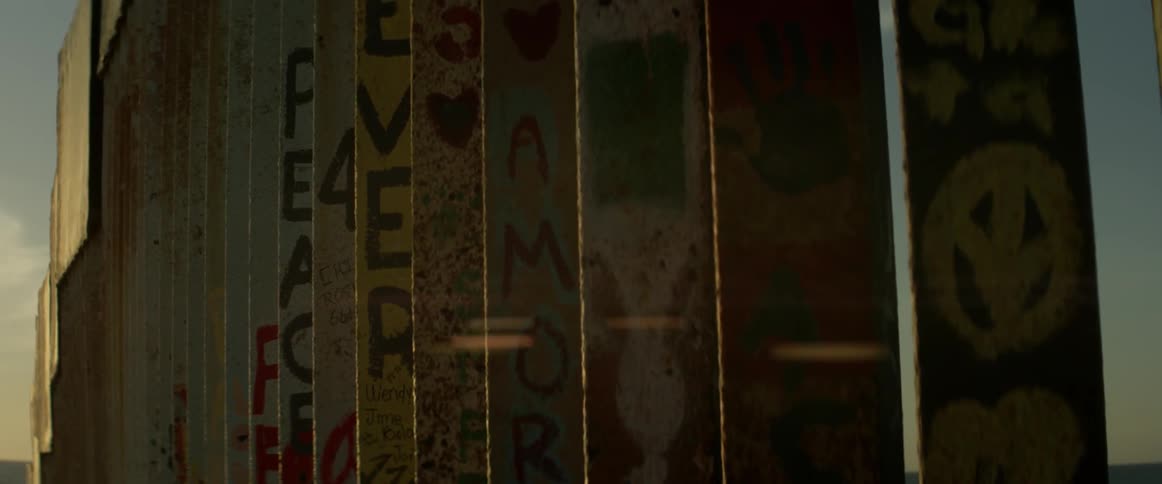 Sunlight shines down on painted posts