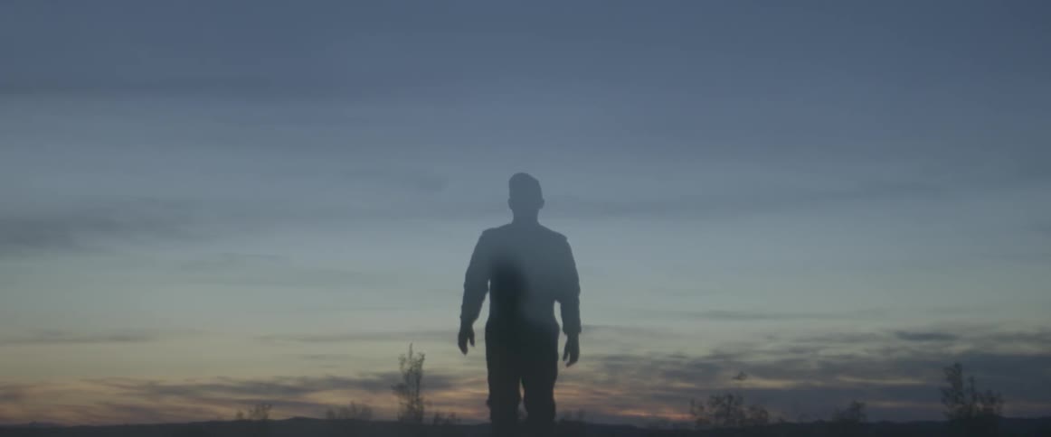 A man walks up a hill