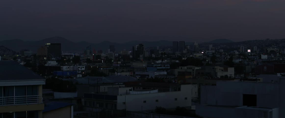 A city near a mountain at night