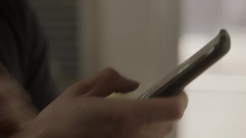 A man uses a smartphone