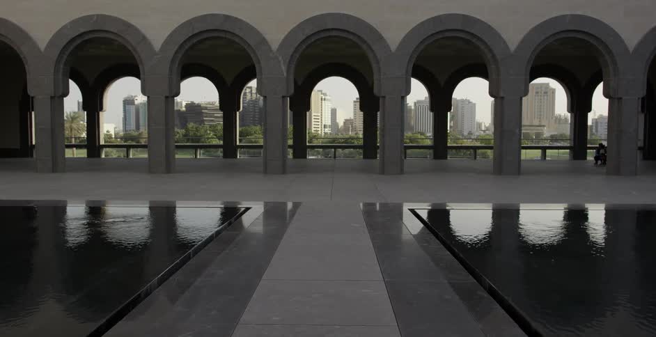 Arched doorways near two small pools
