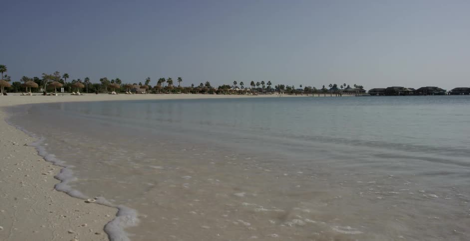 Small waves coming ashore on a beach
