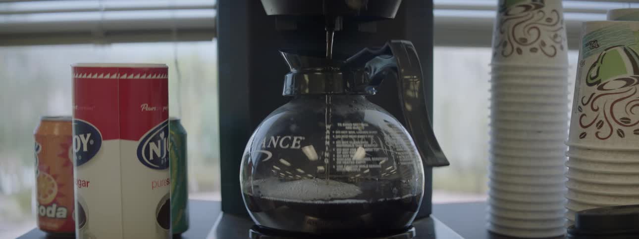 A pot of coffee is brewing