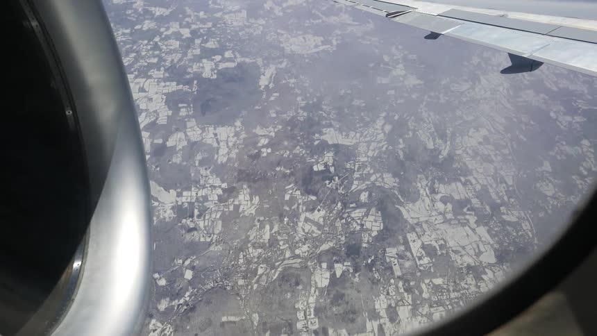 An aerial view of a city with roads and buildings