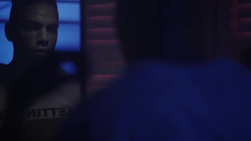 A man watches himself in the mirror
