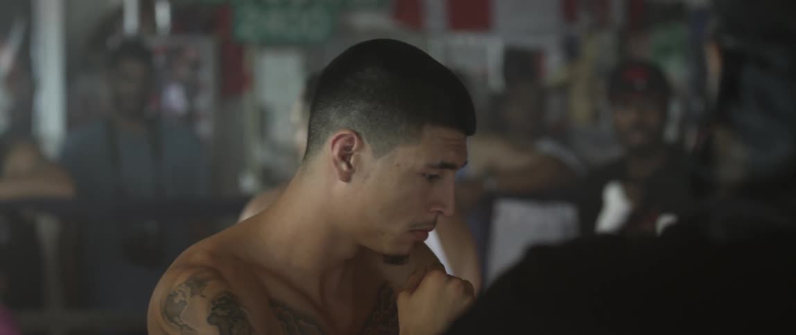 People boxing in a gym