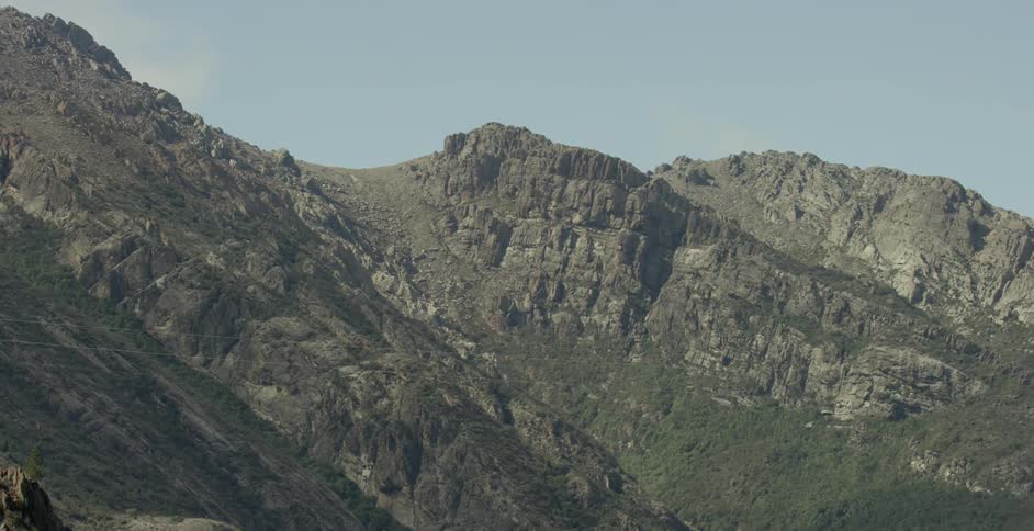 Mountain range sits under the blue sky